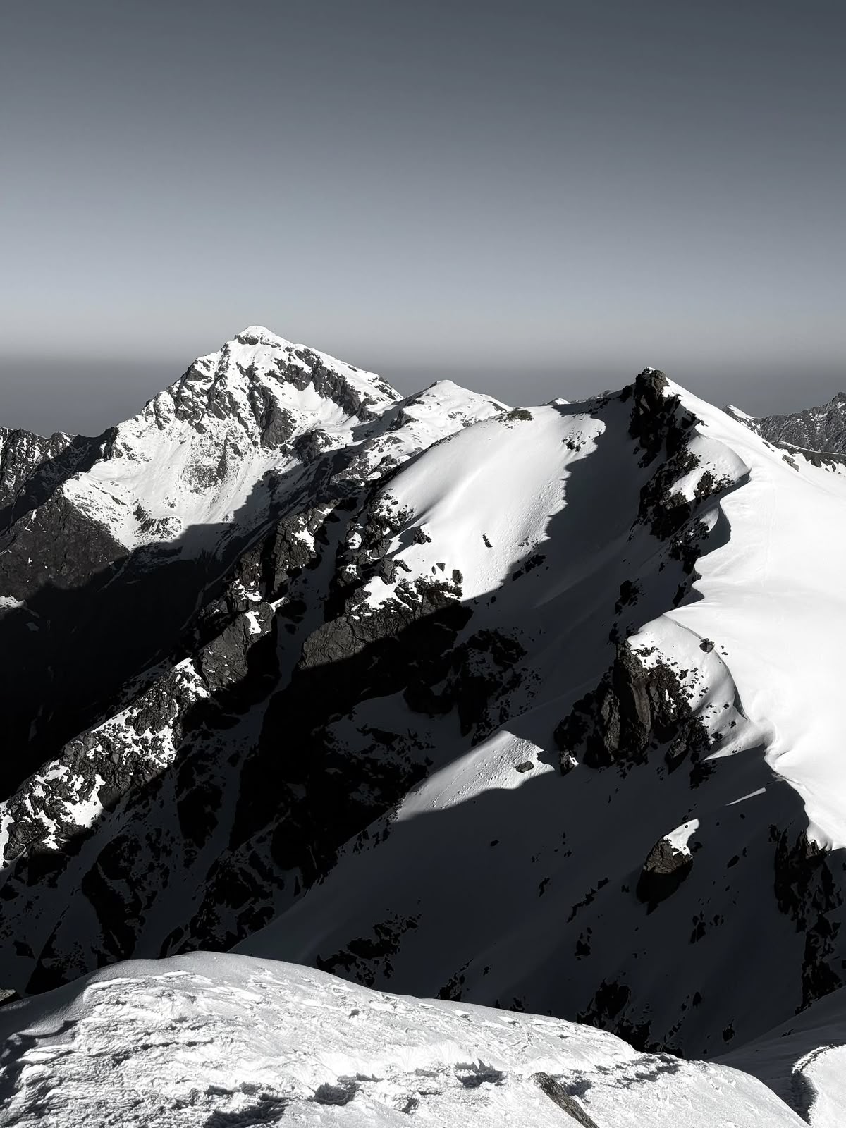 Snow and rock on the ridgeline above the pass