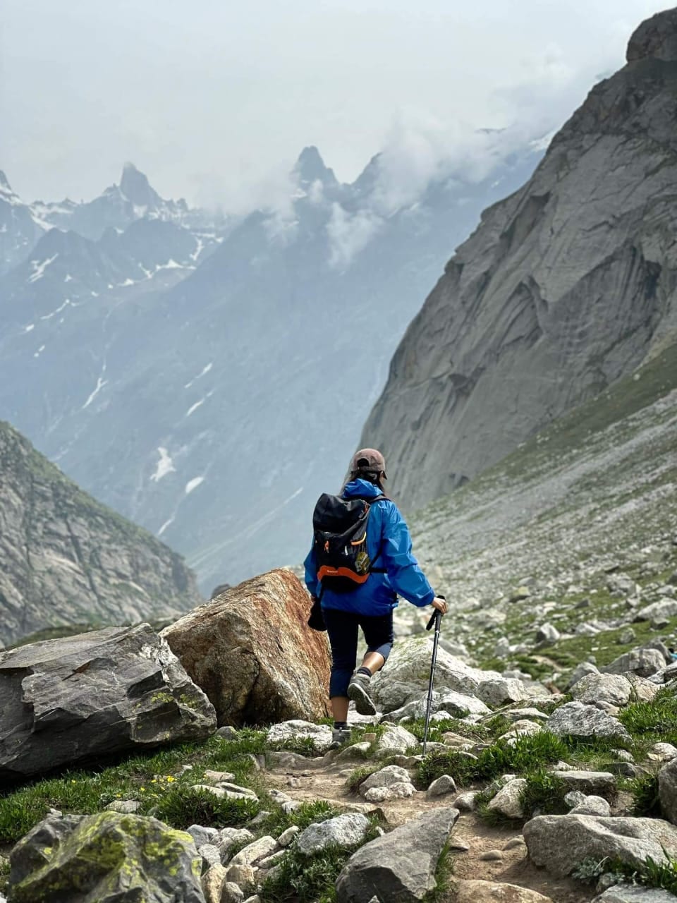 Climbing the rocky trail as the cloud comes in